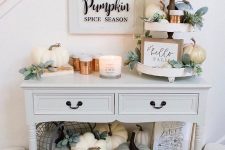 11 neutral fall styling with neutral faux pumpkins and greenery, candles and some signs plus copper cups is chic