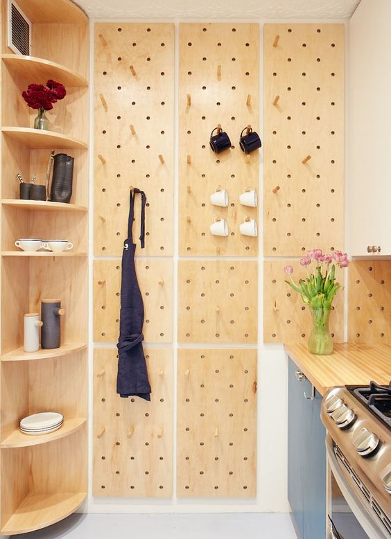 a built-in corner shelving unit with rounded shelves is a cool idea for a contemporary kitchen