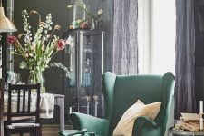 12 a refined vintage-inspired space with a hunter green wingback chair and a footrest by the window to read comfortably here