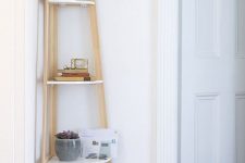 16 a stylish corner shelf with rounded shelves is great for the hallway, keeping all those essentials ready anytime you need them