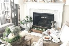 16 natural rustic fall decor with greenery, real pumpkins and gourds, a leaf wreath, a box with moss and white pumpkins