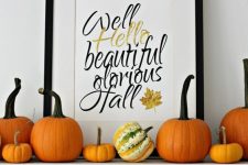 18 a simple modern fall mantel with natural pumpkins, a large fall sign is easy to recreate and looks cool