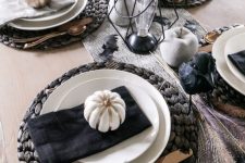 19 a gorgeous fall tablescape with a printed runner, white and gilded apples and pumpkins, black napkins and metallic cutlery