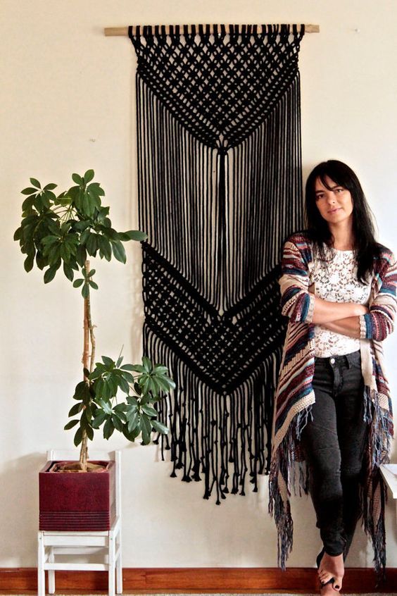 if you are good at macrame, you may create such a black hanging for statement Halloween decor