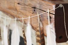 24 skip usual skull and candy corn buntings and go for a dipped feather garland for a boho feel in your space