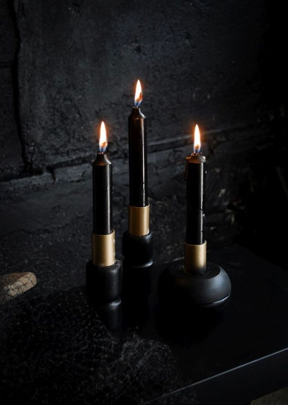 stylish black and gold candleholders are amazing for Halloween decor, they will work for modern and minimalist themes