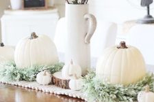 26 chic fall table styling with a crochet runner, greenery, white pumpkins and a leaf arrangement in a jug