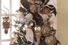 a fall tree with twine blls, brown ribbons, owls, acorns and branches plus some lights can be a fit for Thanksgving
