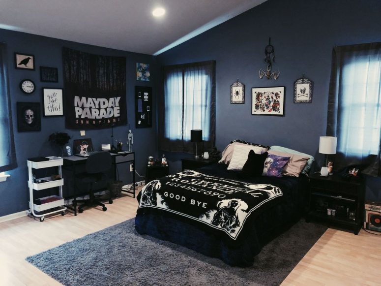 a moody Halloween bedroom with spooky bedding and bold pillows, signs and a gallery wall plus dark furniture