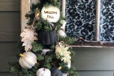 a small fall tree with white and black pumpkins, paper leaves, a plaid ribbon and some lights can fit Thanksgiving, too