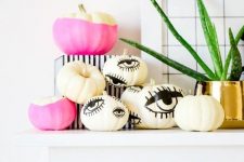 classy Halloween mantel decor with eyed and color block pumpkins is a timeless and chic minimalist idea