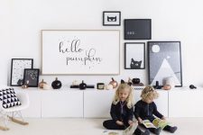 minimalist Halloween styling with copper, black and white pumpkins and a black and white gallery wall