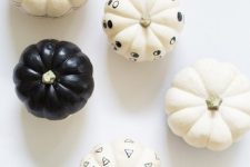minimalist black and white pumpkins with patterns can be easily create using some paint and a sharpie