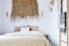 04 a comfy pallet bed with several layers of storage inside perfectly fits a boho chic bedroom
