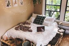 05 a cozy pallet bed with storage space inside and on top – place whatever you want there