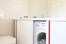 a minimalist bathroom design with a hidden washing machine