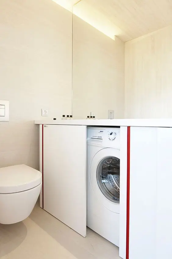 a minimalist bathroom design with a hidden washing machine