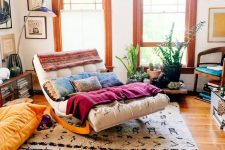 06 a neutral tufted rocking lounger with plenty of blankets and pillows is a cool idea for a slightly boho space