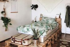 09 a pallet guest bed with planters and a space for a suitcase is perfect and you can DIY it