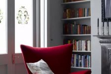 10 a bold red wingback chair with sharp geometric lines and a pillow is a bright statement for your reading nook