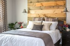 10 a reclaimed wood headboard coming up to the ceiling makes a statement and adds texture