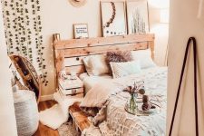 10 a rustic meets industrial bed built of pallet wood will easily fit a rustic or boho bedroom