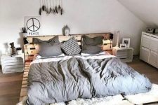 11 a simple low pallet bed with a headboard and whitewashed crate nightstands