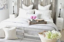 12 a shabby chic whitewashed headboard made of planks of different height