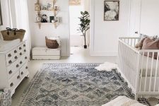 17 a neutral famrhouse meets boho nursery with a beaded chandelier, a Moroccan blanket ottoman and baskets