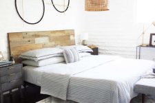 17 a serene modern bedroom with a reclaimed wooden headboard, a wicker pendant lamp and printed textiles
