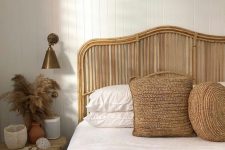 19 a boho headboard made of rattan and jute pillows give a summer feel to the space