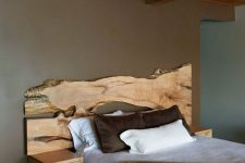 20 a live edge wooden headboard with little floating nightstands adds a natural feel to the space