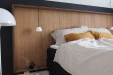 22 a sleek wooden headboard with a frame matches this Scandinavian bedroom and brings coziness and warmth here