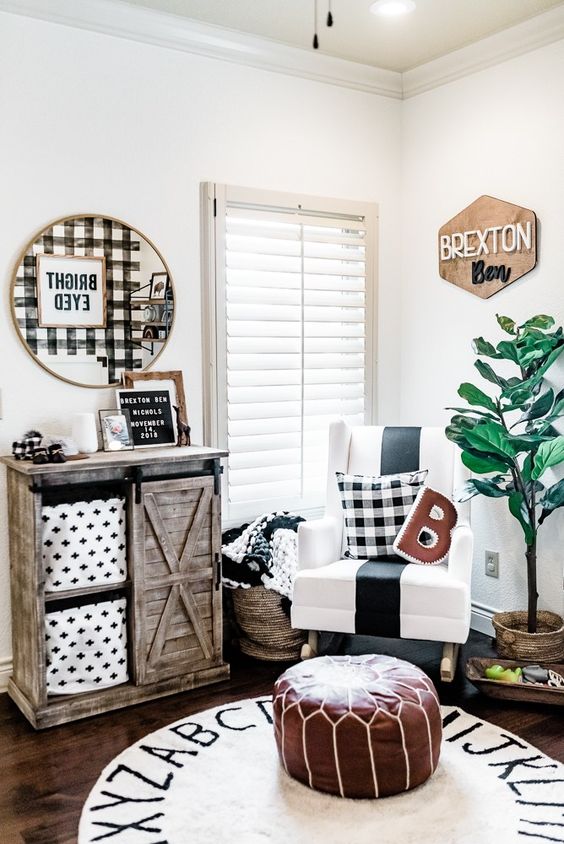 a super bright and cozy farmhouse nursery with a name sign of plywood in the corner is a cool idea