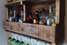 24 a rustic pallet wine rack with wine bottles and liquors and storage for glasses