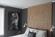 25 a contemporary monochromatic bedroom with a sleek woodne plank headboard that goes up the wall to the ceiling