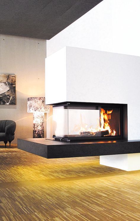 a contrasting minimalist fireplace in black, white and with a glass cover is a cozy and chic piece to make a statement