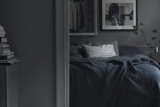 a grey bedroom design with a moody feel