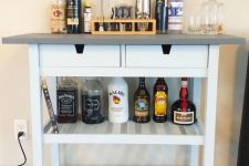 a stylish IKEA Forhoja bar cart hack with a sleek grey countertop and drawers is an ultimate modern farmhouse option