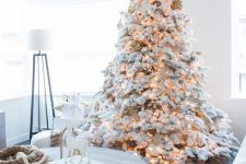 03 a flocked Christmas tree with matching white and silver ornaments, pinecones and lights is a lovely idea for Christmas