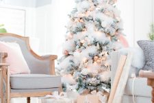almost all-white christmas tree decor with golden touches