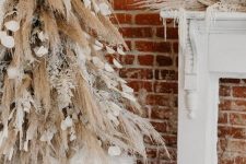 04 a creative boho Christmas tree of pampas grass and snowy branches, petals and ribbons and matching mantel decor