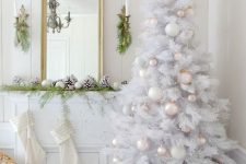 07 a pure white Christmas tree with tender pastel and white ornaments and bead garlands is a chic idea for holidays