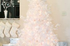 10 a lovely white Christmas tree with lights, berries and white ornaments plus a light star topper is a gorgeous idea to try