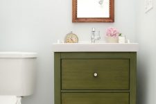 10 an IKEA vanity redone in grassy green to make it look bold, chic and cool and to add color to this vintage-inspired space