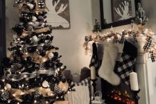 14 a rustic black Christmas tree with lights, plaid and burlap ribbons, black and white ornaments and snowy pinecones