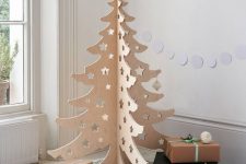 17 a pretty 3D carved plywood Christmas tree with cut out stars is a cool and ultra-modern idea and you can fold it easily