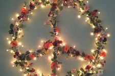 18 boho floral and light Christmas peace sign wreath is ideal for free-spirited Christmas decor inside and outside
