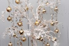 22 a whimsical white tree with refined gold ornaments is a lovely solution for Christmas celebrating and it will make a statement