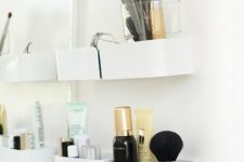 22 an Ikea Pluggis system is used to create a perfect makeup storage station for a bathroom or some other space